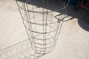 cylindrical tomato cage made from wire fence