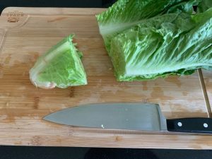 Cut lettuce with knife