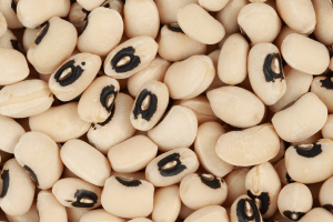 whole frame filled with black-eyed peas, creamy white with a black spot